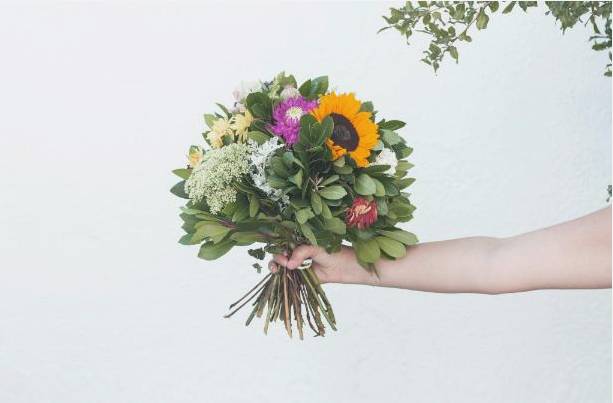 Students with bouquets