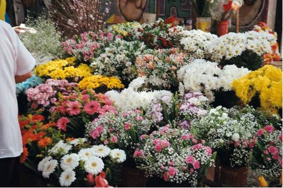 Private workshop group arranging flowers